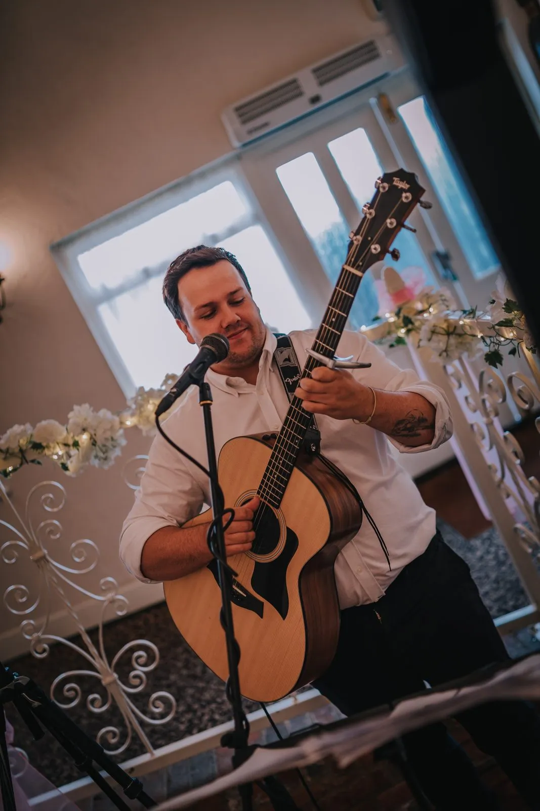 Jordan Richards performing live acoustic guitar and vocals at an Essex wedding